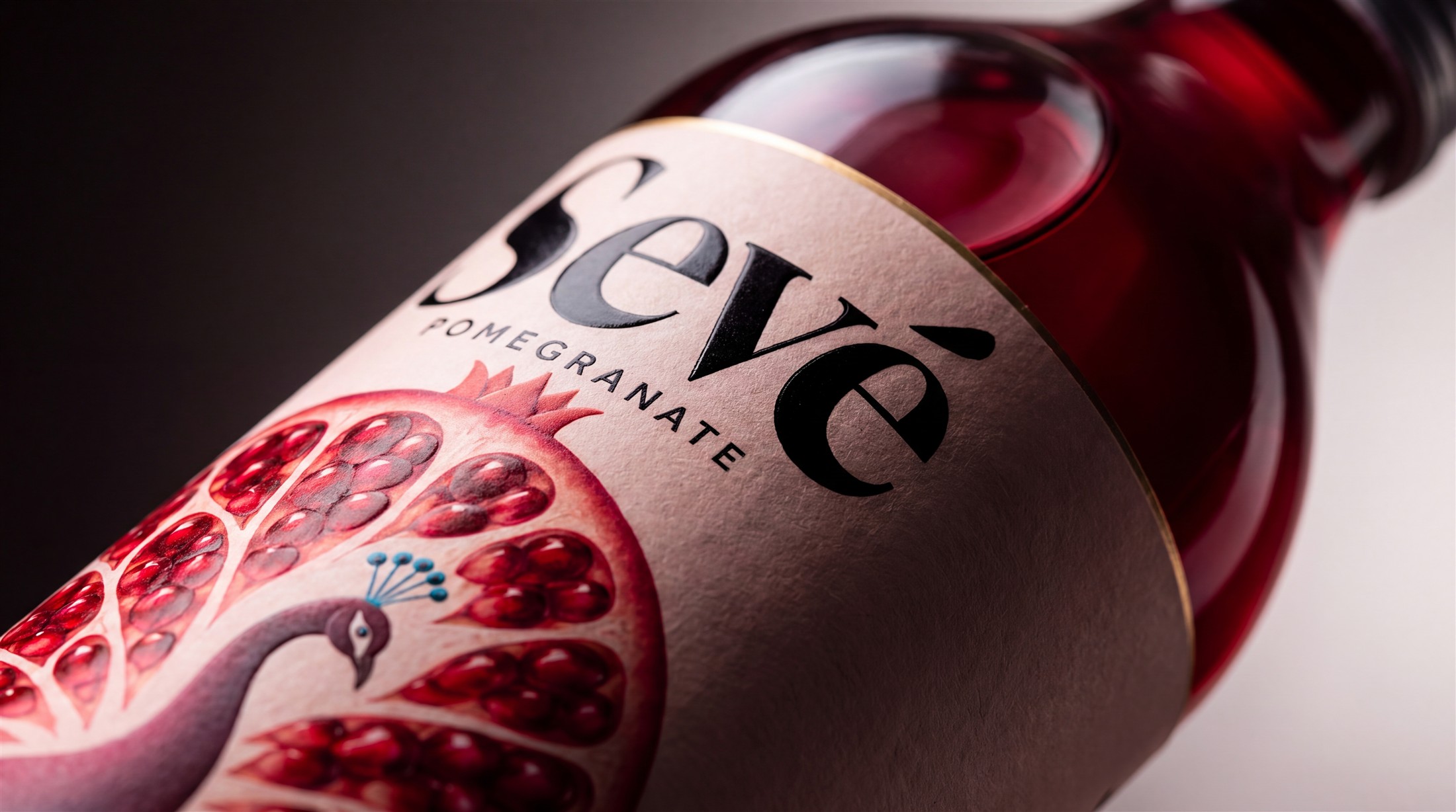 Close-up of the SEVÉ pomegranate bottle label
